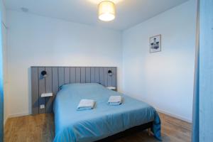 Giường trong phòng chung tại Gîte du Cellier - Jardin et terrasse