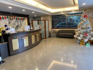 a lobby with a christmas tree in a store at Hub Hotel - Zhongshan Branch in Taipei