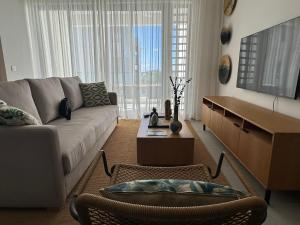 Et opholdsområde på Naccara Luxe Apartment Grand Baie Beachside
