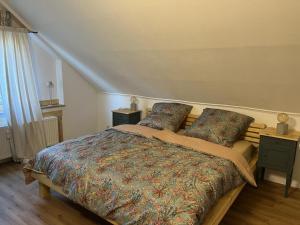 a bedroom with a large bed with two pillows at NEU! Ferienwohnung Bottelterberg in Saarburg