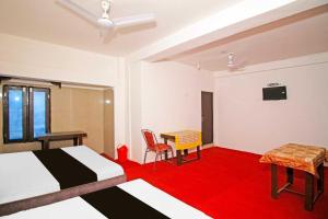 Postel nebo postele na pokoji v ubytování Hotel O by OYO Kalka