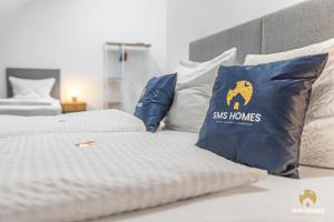 En eller flere senge i et værelse på SMS-Homes I Auszeit am See #2