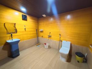 a bathroom with a sink and a toilet at Monsoon in Agonda +172 photos