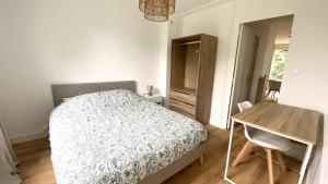 En eller flere senge i et værelse på T2 refait à neuf Quartier Chantenay avec Parking