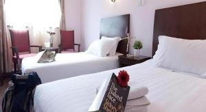 Ένα ή περισσότερα κρεβάτια σε δωμάτιο στο Shijia Inn On the Bund +56 φωτογραφίες