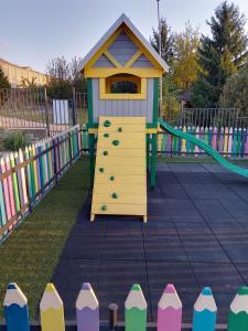 a playground with a colorful play structure at A frame Alba Iulia in Alba Iulia
