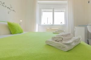 Postel nebo postele na pokoji v ubytování L'Ormeggio