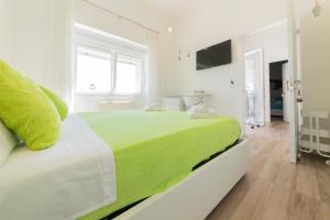 Postel nebo postele na pokoji v ubytování L'Ormeggio