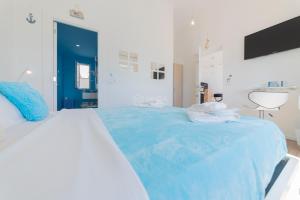 Postel nebo postele na pokoji v ubytování L'Ormeggio + 8 fotografií