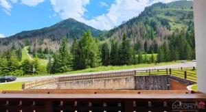 a view of a mountain from a bench at Precumon 8'1 in Arabba
