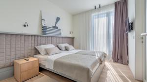 En eller flere senge i et værelse på Villa Sunray by Villas Guide + 32 billeder