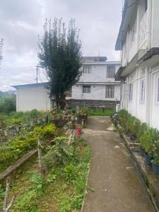 a garden in front of a building at A Villa in Shillong