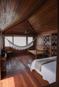 En eller flere senge i et værelse på Canto do Mar Caraiva