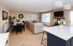 a living room with a couch and a table at The Views Retreat in Newcastle