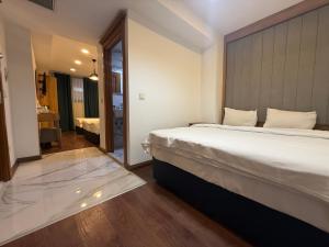 Postel nebo postele na pokoji v ubytování Pege Hotel