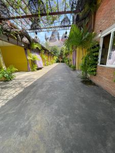 an empty street in front of a building at Maam Guesthouse in Phnom Penh +2 photos