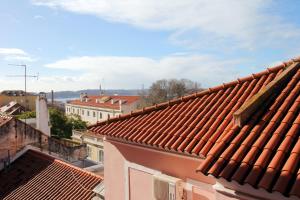 a view of roofs of buildings in a city at WOT New Lisbon Social in Lisbon