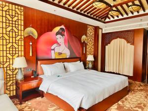 En eller flere senge i et værelse på Suiton Plus By Paxton