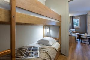 Postel nebo postele na pokoji v ubytování Résidence Pierre & Vacances La Rivière