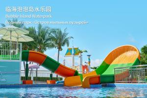 a water slide in a pool at a water park at MGM Grand Sanya in Sanya