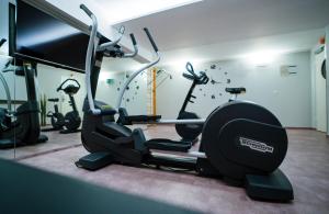 a gym with several exercise bikes in a room at Ibercity Wien Schönbrunn in Vienna