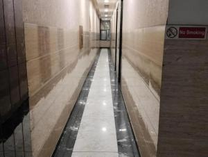 a hallway in a building with a bowling alley at Hotel Ravi Residency in Jalandhar