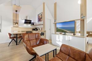 TV/trung tâm giải trí tại Dünenhaus Ückeritz UnserUsedomDe FeWo ca23qm mit Parkplatz direkt am Strand 11I4