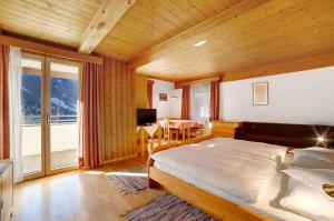 Postel nebo postele na pokoji v ubytování Gasthof Kirchsteiger