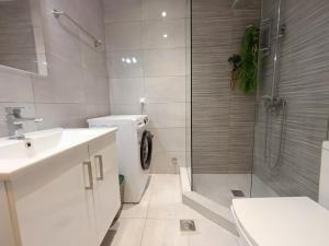 a bathroom with a shower and a toilet and a sink at Molly Downtown Thessaloniki in Thessaloniki +15 photos