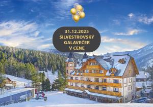 a large building with gold balloons on top of it at Grand Hotel**** Bachledka Strachan in Ždiar