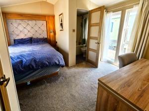 En eller flere senge i et værelse på Ocean Edge Leisure Park - Holiday Accommodation 21286