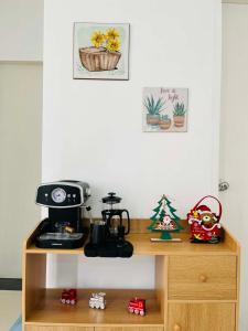 a wooden shelf with a coffee maker on top of it at Selah Stay in Manolo Fortich