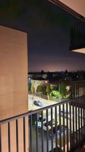 a balcony with a view of a parking lot at GOLD APARTAMENT Ząbki in Ząbki