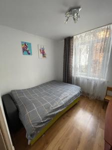 Postel nebo postele na pokoji v ubytování Apartment Bombonyerka