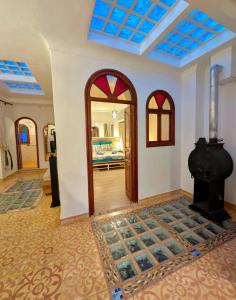 a room with a door and a room with a bedroom at DAR Dunia Panoramic terrace in Chefchaouen +91 photos