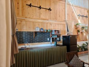 a kitchen with a sink and a refrigerator at MOre home 2 - ngôi nhà nghĩ dưỡng tại Đà Lạt in Da Lat +9 photos