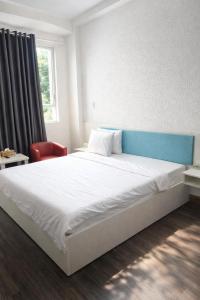 En eller flere senge i et værelse på Hưng Phú 3 Hotel