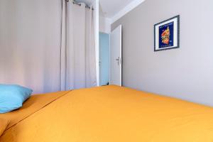 En eller flere senge i et værelse på L'Appartement Cinto - Proche de L'île Rousse