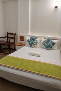 Postel nebo postele na pokoji v ubytování Male City Stay