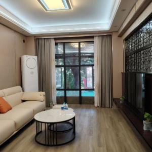 TV a/nebo společenská místnost v ubytování Sanya Weilan Homestay - Dadonghai Luhuitou Scenic Area Branch