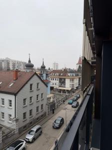 a view of a city street with cars parked at Palata Royal Banja Luka Luxury Apartment in Banja Luka