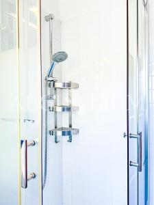 a shower in a bathroom with a glass door at Villa Giglio Rosso in Campese +14 photos