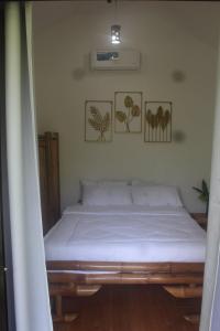 Postel nebo postele na pokoji v ubytování Bay de Emmanuel Rooms + 6 fotografií