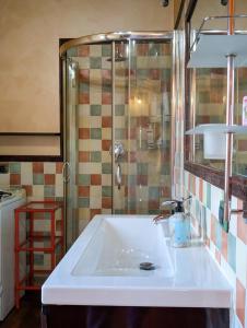 a bathroom with a sink and a shower at Openspace Attic Apartment with terrace, Wi-Fi in Saronno +32 photos