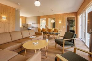 a living room with a couch and a table at Center Parcs Nordborg Resort in Nordborg