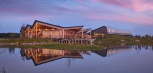 a large building sitting on top of a body of water at Center Parcs Nordborg Resort in Nordborg