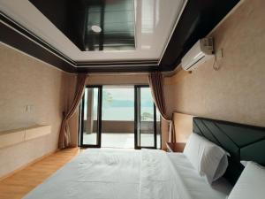 En eller flere senge i et værelse på Rodeo Inn