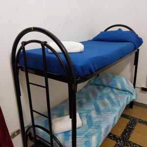 a couple of bunk beds in a room at Sahary in Naples