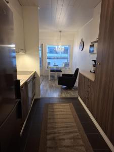 a kitchen with a table and a dining room at Starvillas B201 in Kalajoki