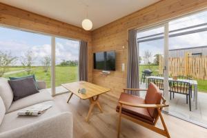 a living room with a couch and a table at Center Parcs Nordborg Resort in Nordborg